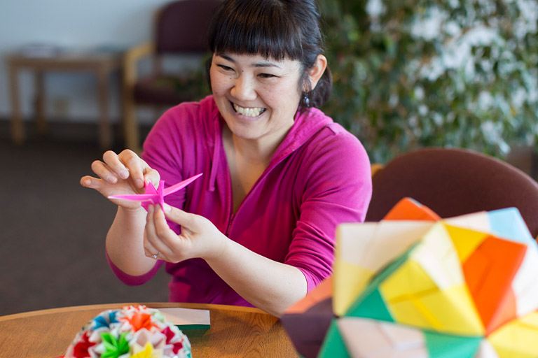 person participating in origami