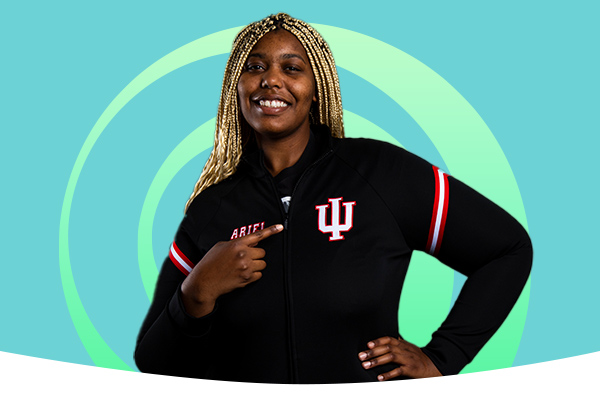 A student in front of a blue background with a gradient swirl behind her